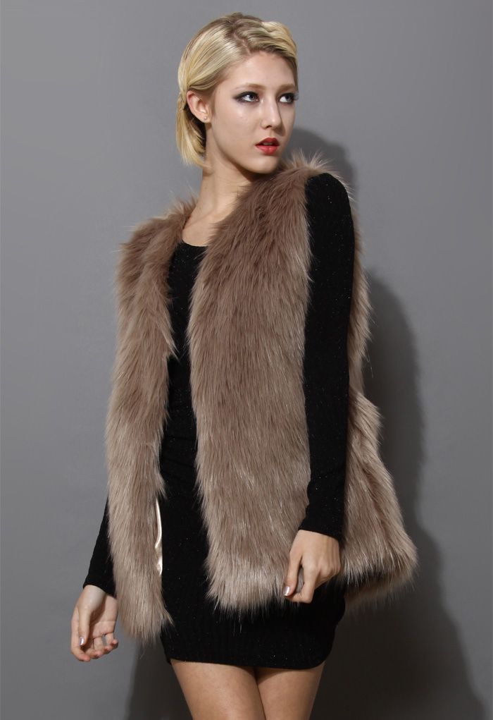 Front view of a mid-length brown faux fur vest with a soft and cozy texture, exuding a chic and elegant vibe.