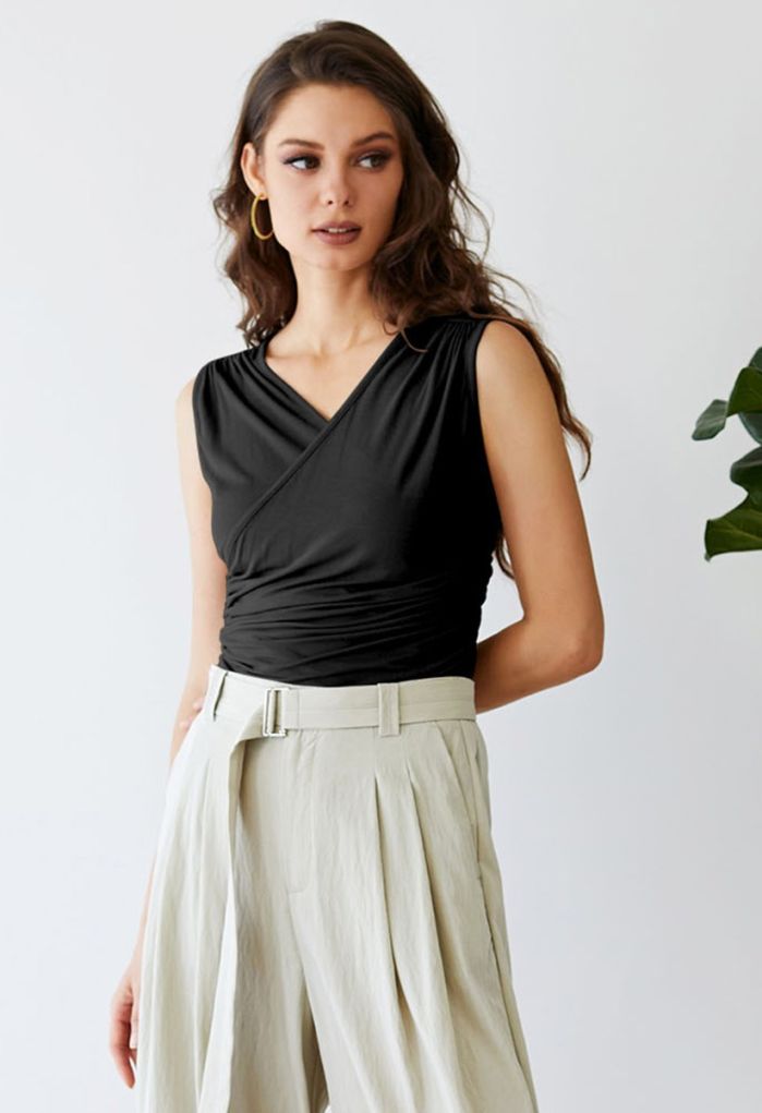 Faux-Wrap Ruched Sleeveless Top in Black
