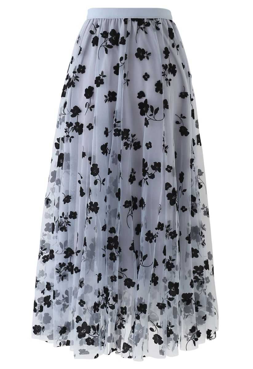 Front view of a romantic dusty blue 3D posy double-layered mesh midi skirt with black floral patterns.