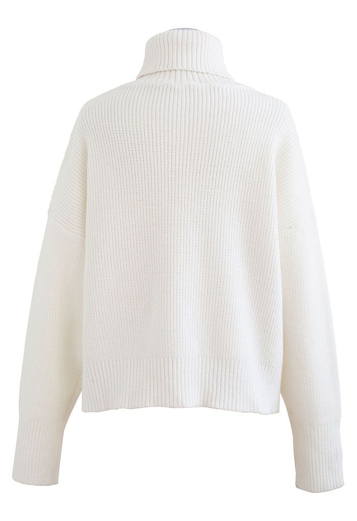 Back view of the white turtleneck crop sweater, displaying its simple and elegant design.
