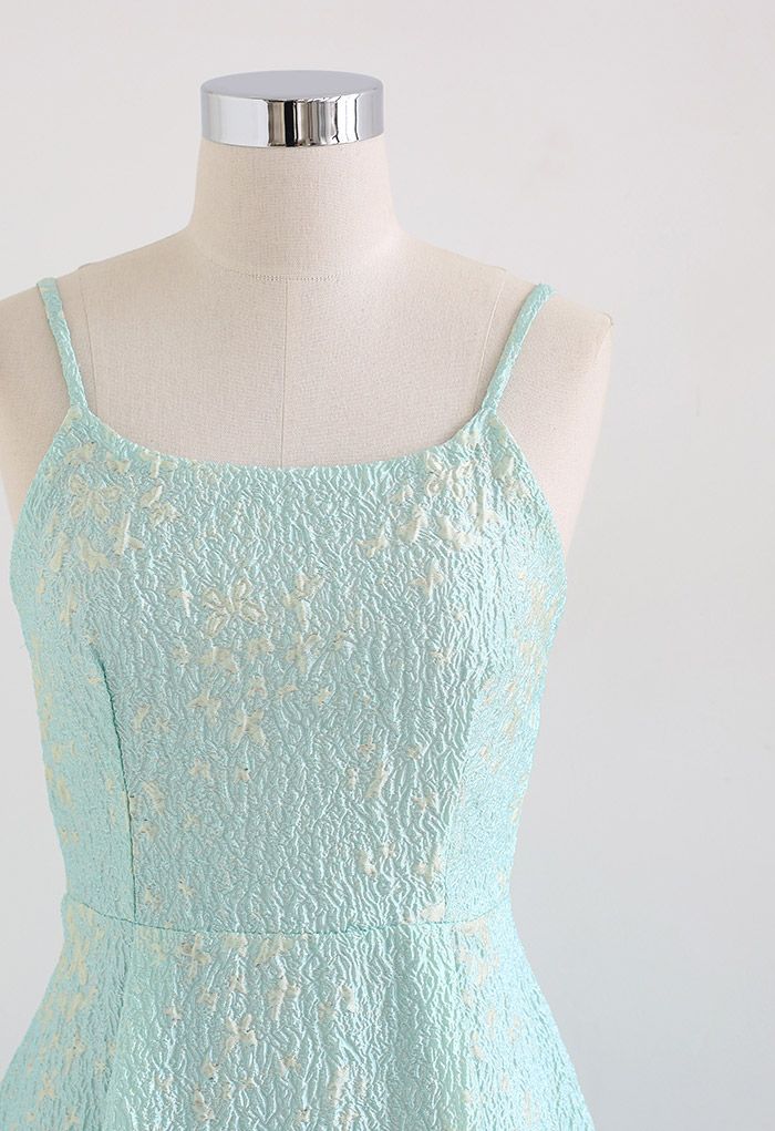 Close-up front view of the blue cami midi dress, showcasing the delicate butterfly embroidery and embossed texture.