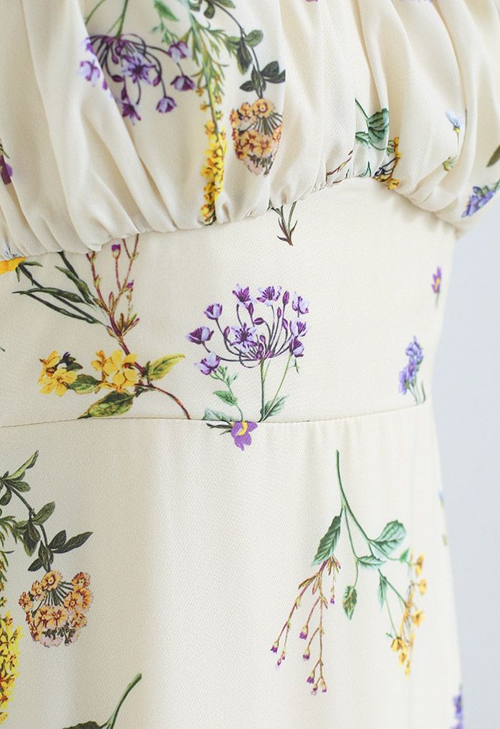 Close-up of the bodice, showing intricate floral patterns and gathered fabric.