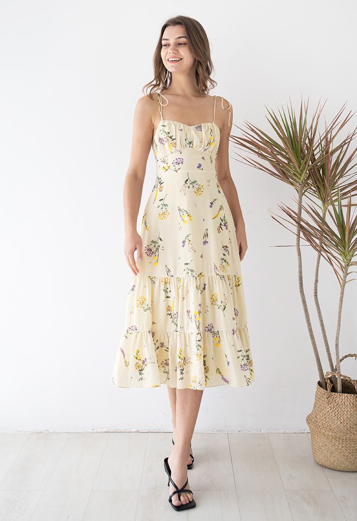Model wearing the dress, showcasing its romantic style and floral print in an outfit shot.