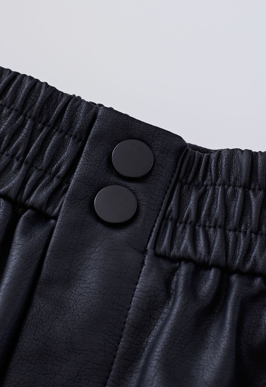 Textured Buttoned Faux Leather Shorts in Black