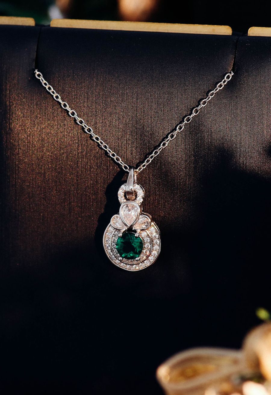 Rounded Halo Emerald Diamond Necklace