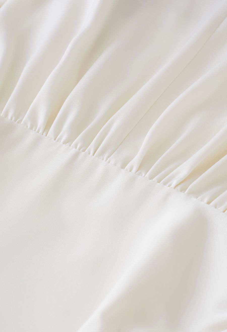 Padded Shoulder Cowl Neck Ruched Satin Dress in Cream