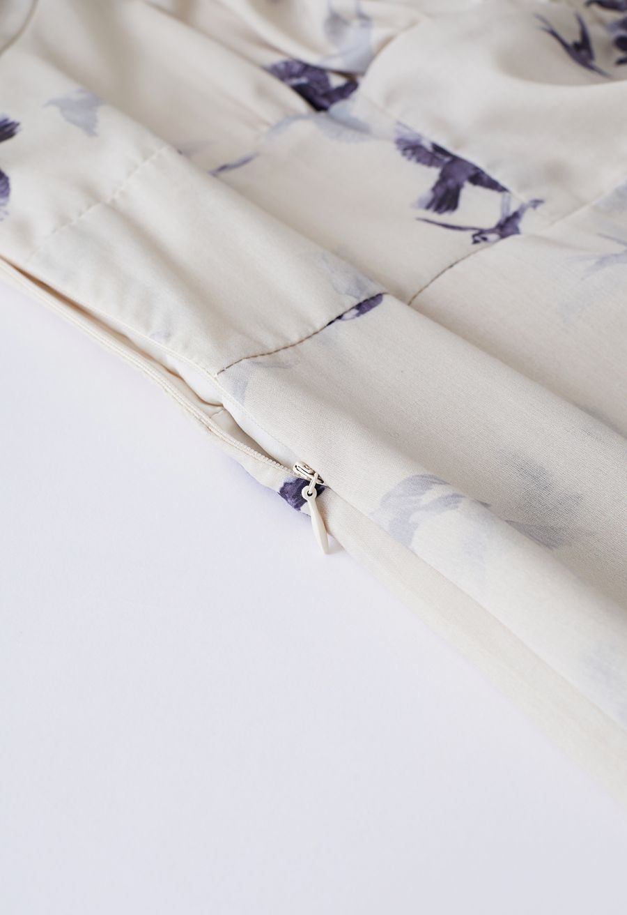 Detail shot of the side zipper on the seagull print midi dress for easy wear.