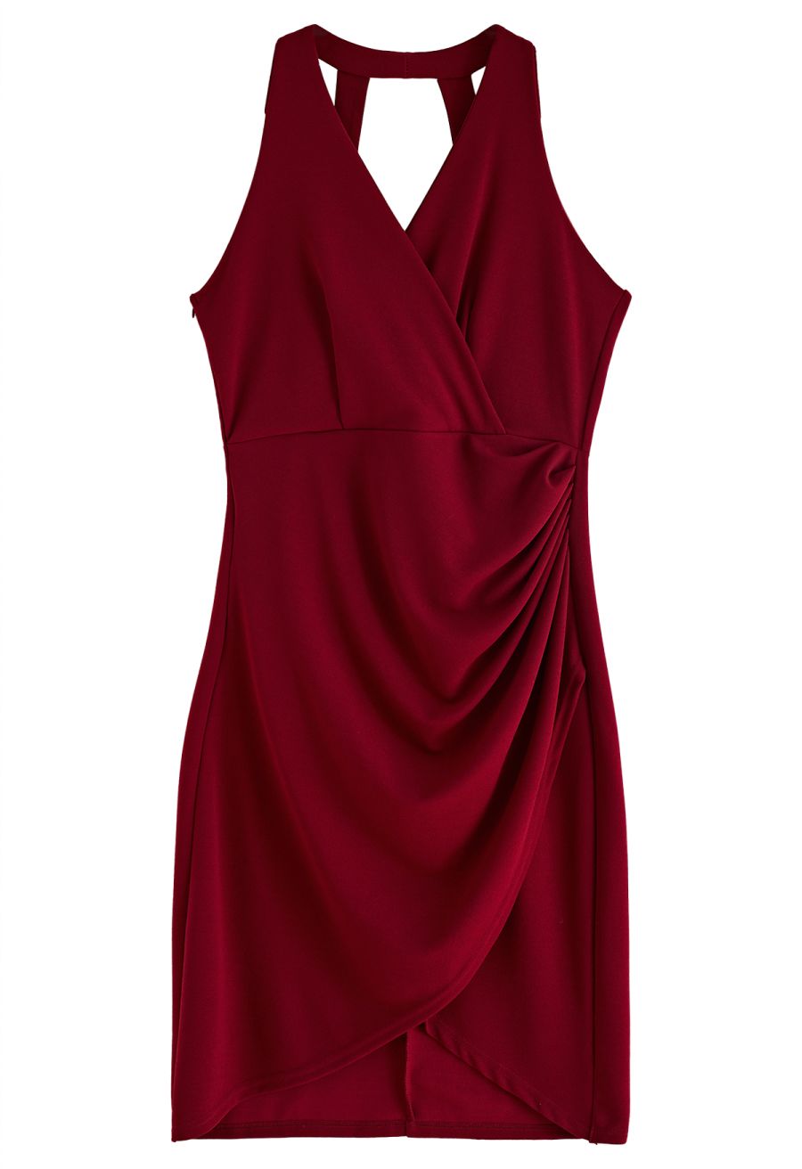 Front view of a burgundy tulip hem ruched wrap dress, featuring a stylish and modern design.
