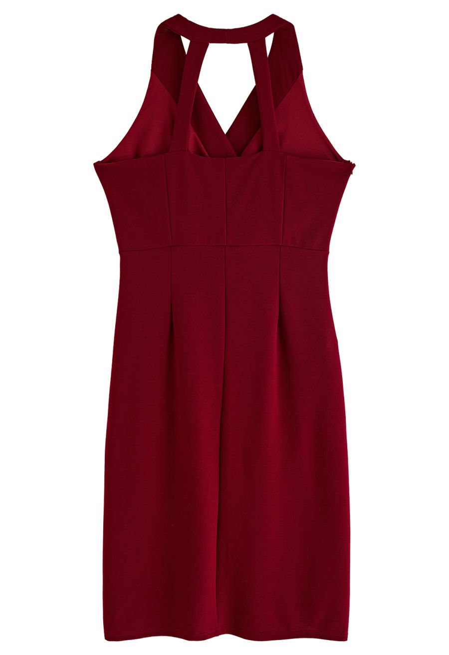 Back view of a burgundy tulip hem ruched wrap dress, showing the sleek and fitted back design.
