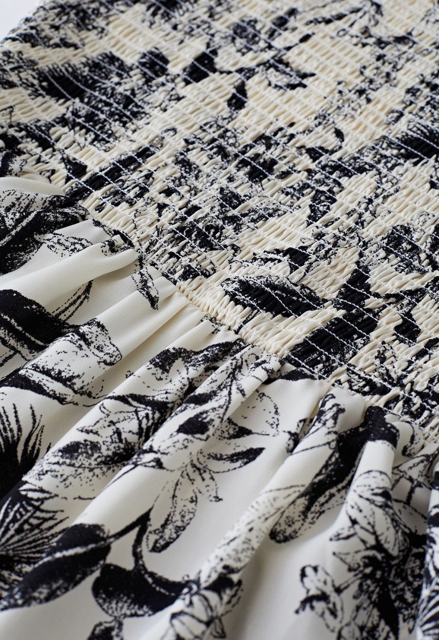 Close-up of the smocked bodice and floral print on the inky botanical print midi dress.