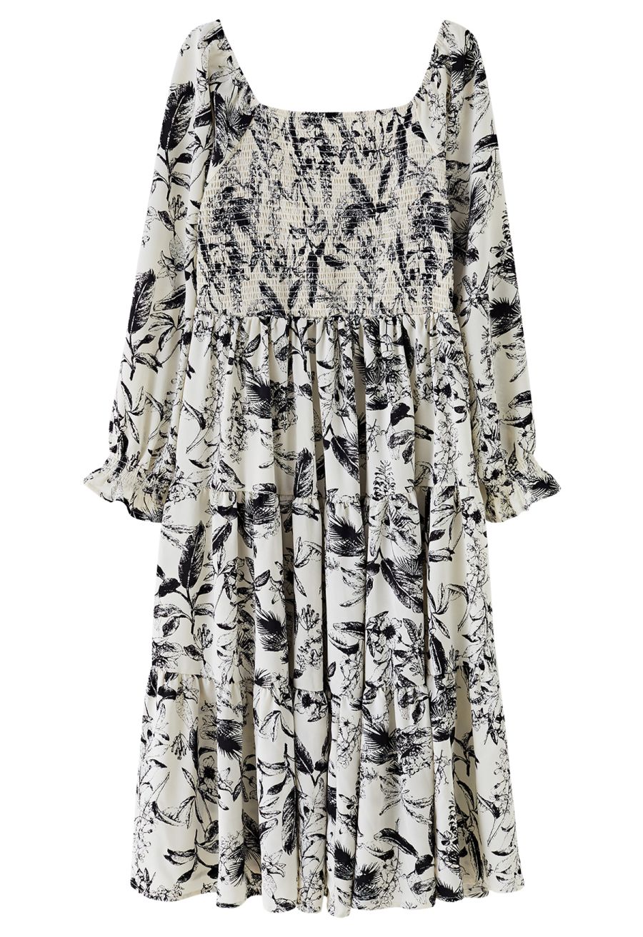 Front view of a romantic inky botanical print square neck midi dress with long sleeves and a flowing silhouette.