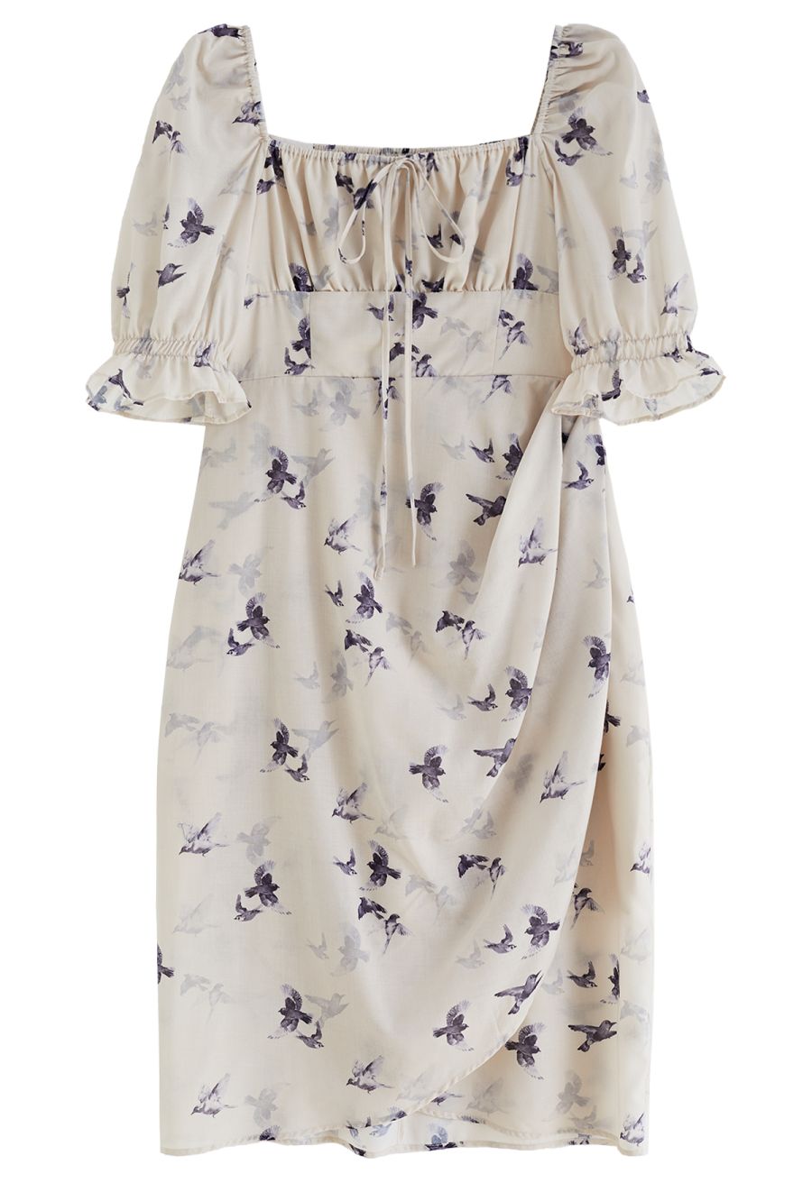 Front view of a seagull print square neck midi dress with puff sleeves and a delicate tie detail for a whimsical look.