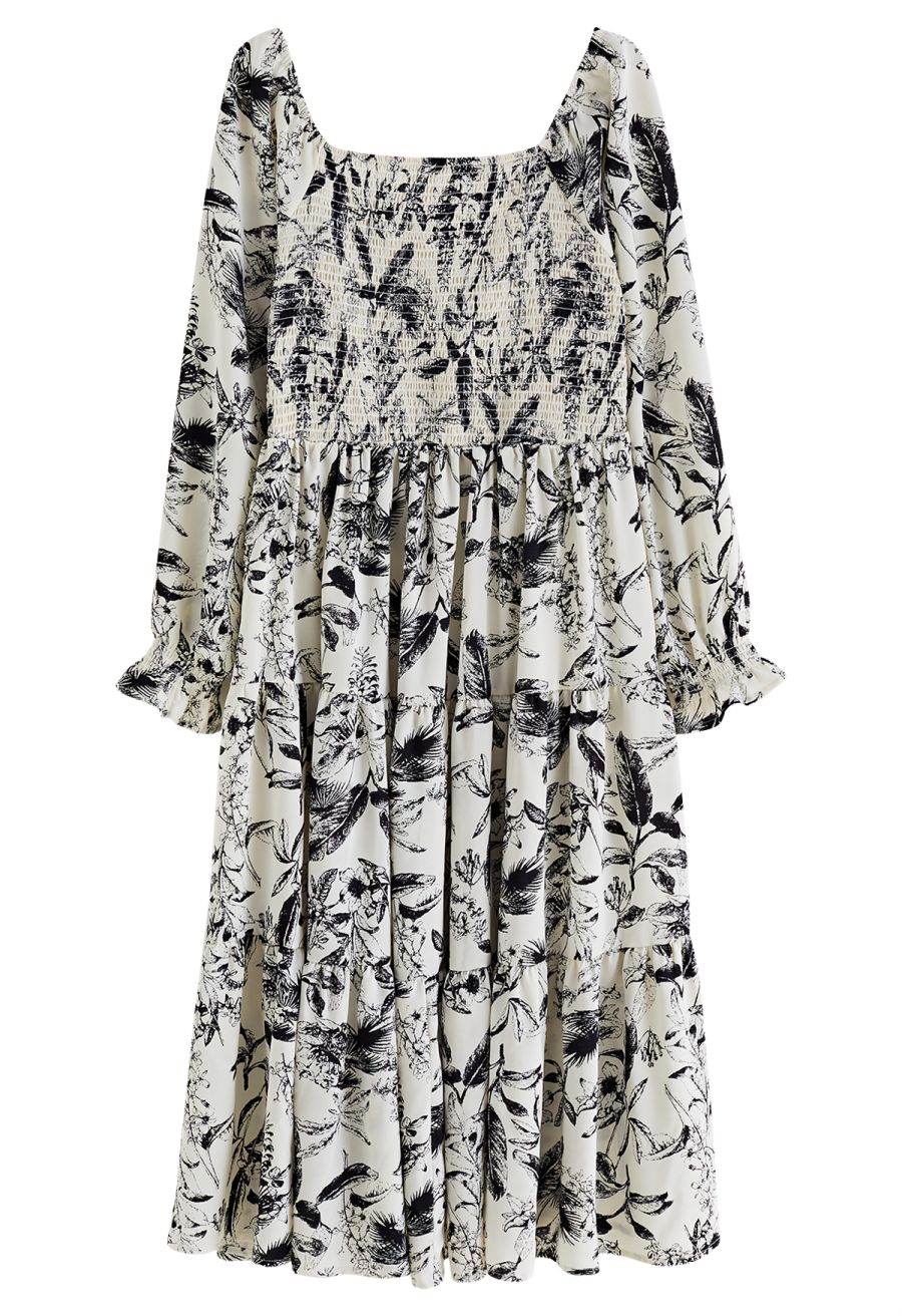 Front view of a vintage-inspired inky botanical print square neck midi dress featuring long sleeves and a tiered skirt.