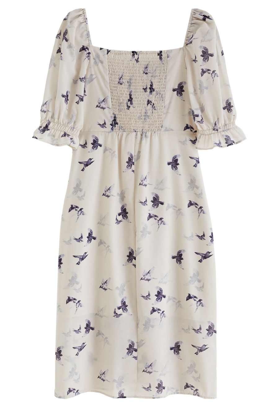 Front view of a romantic seagull print square neck midi dress with puff sleeves.