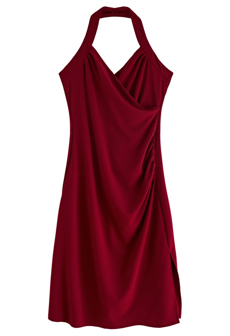 Front view of a burgundy halter neck dress with a wrap bust design, offering a stylish and elegant appearance.