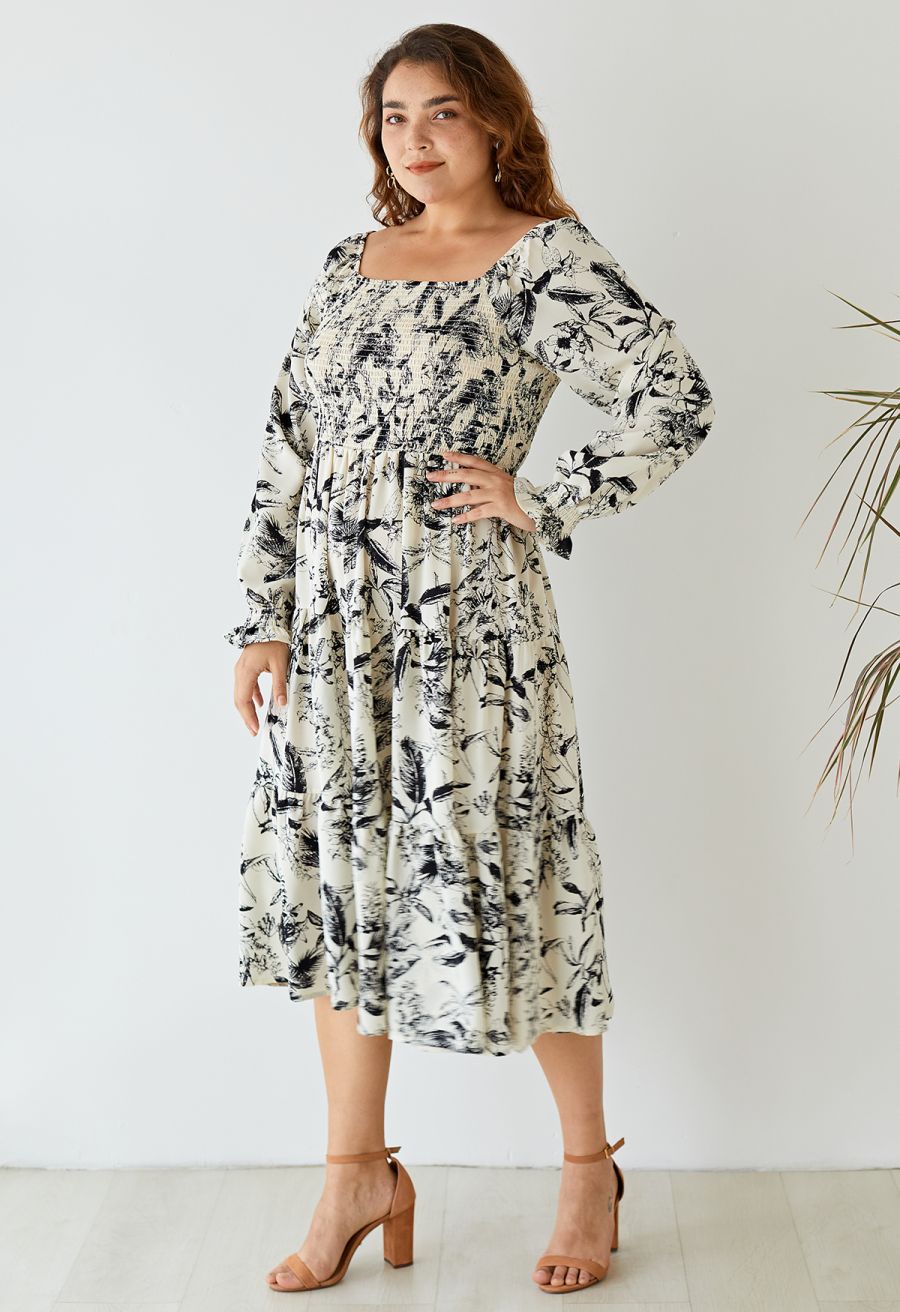 Outfit shot of a woman wearing the inky botanical print square neck midi dress, exuding a romantic and elegant vibe.