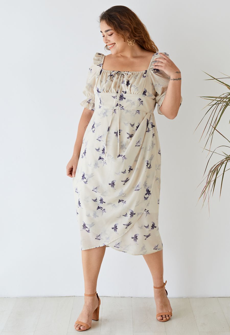 A woman smiling while wearing the seagull print square neck midi dress, creating a cheerful and stylish look.