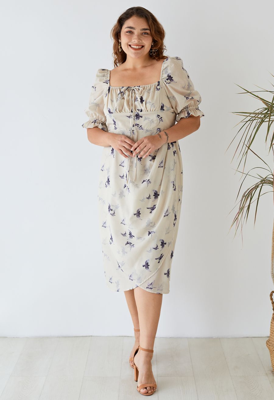 Outfit shot showing a woman wearing the seagull print square neck midi dress, exuding a vintage-inspired vibe.