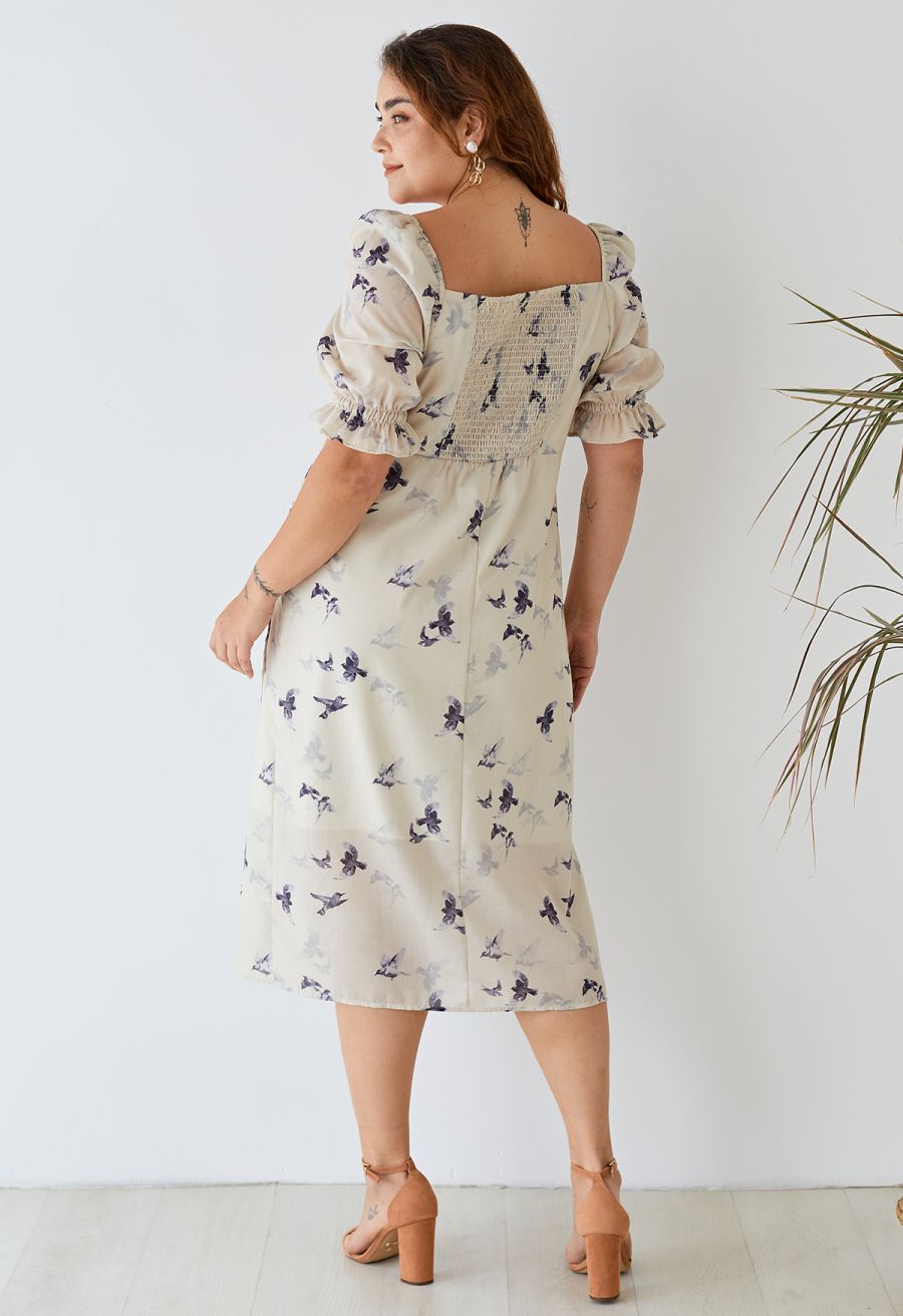 Back view of the seagull print square neck midi dress, showcasing the shirred detail and elegant design.