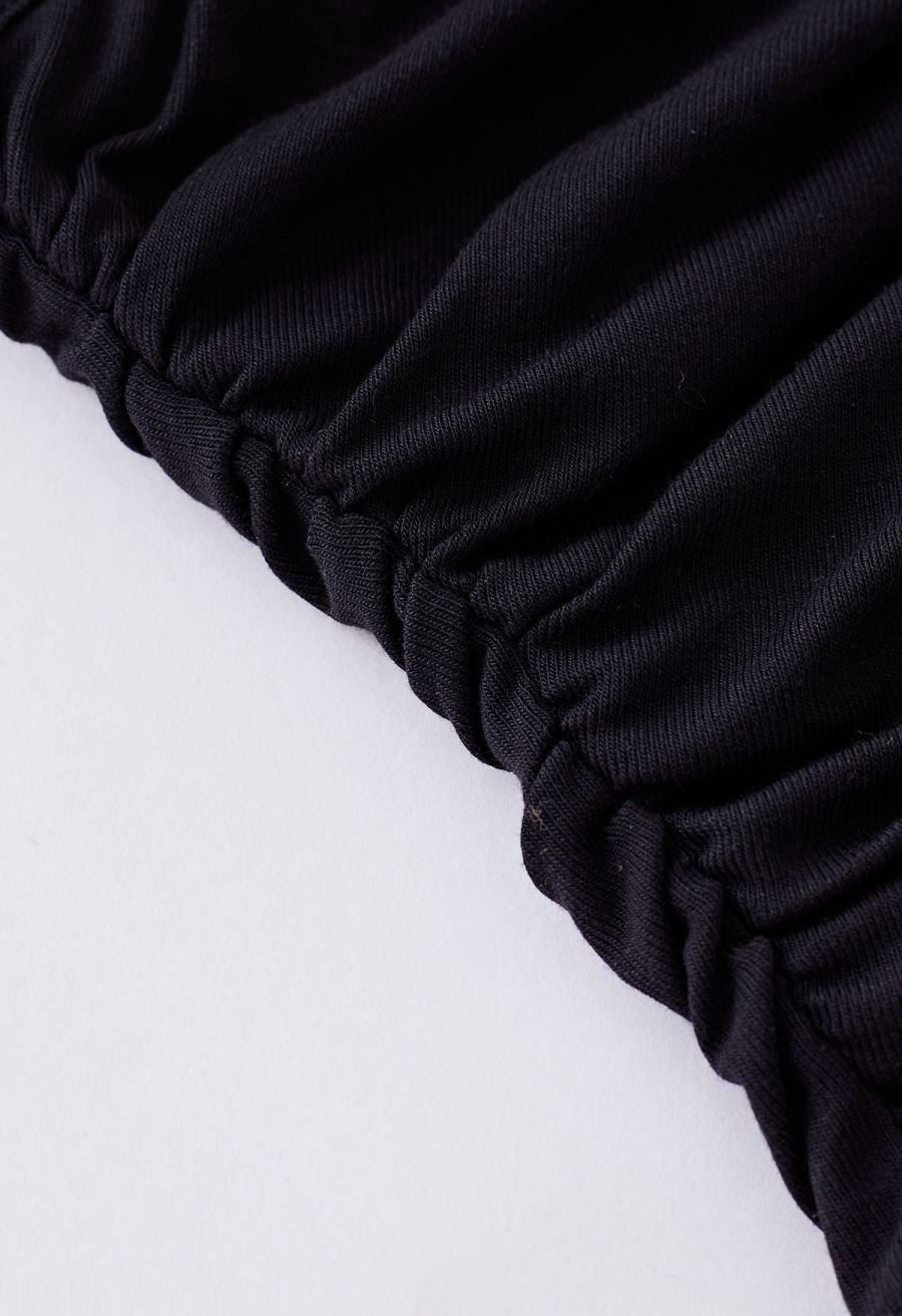 Faux-Wrap Ruched Sleeveless Top in Black