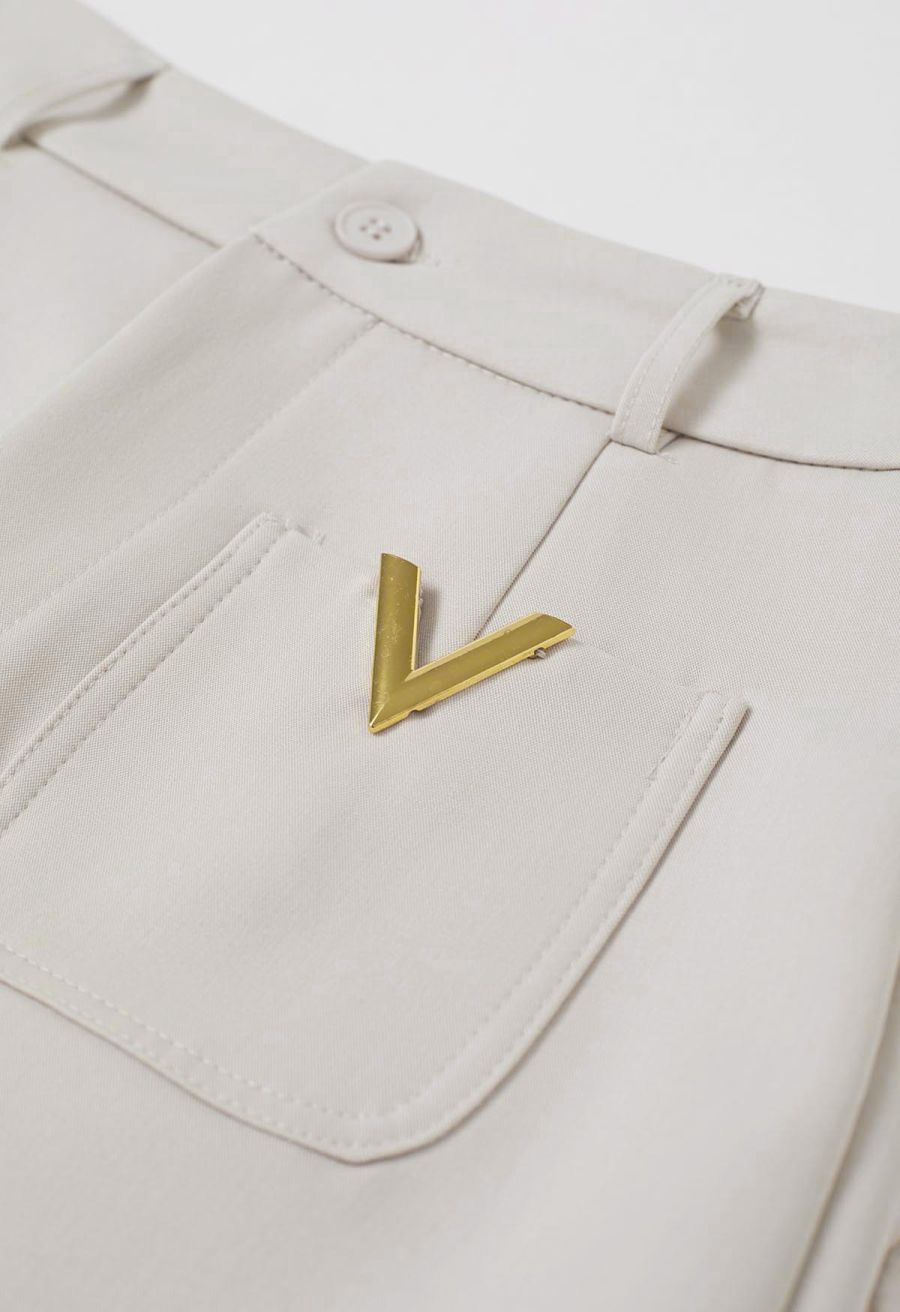 Golden V-Shape Metal Decor Belted Shorts in Ivory