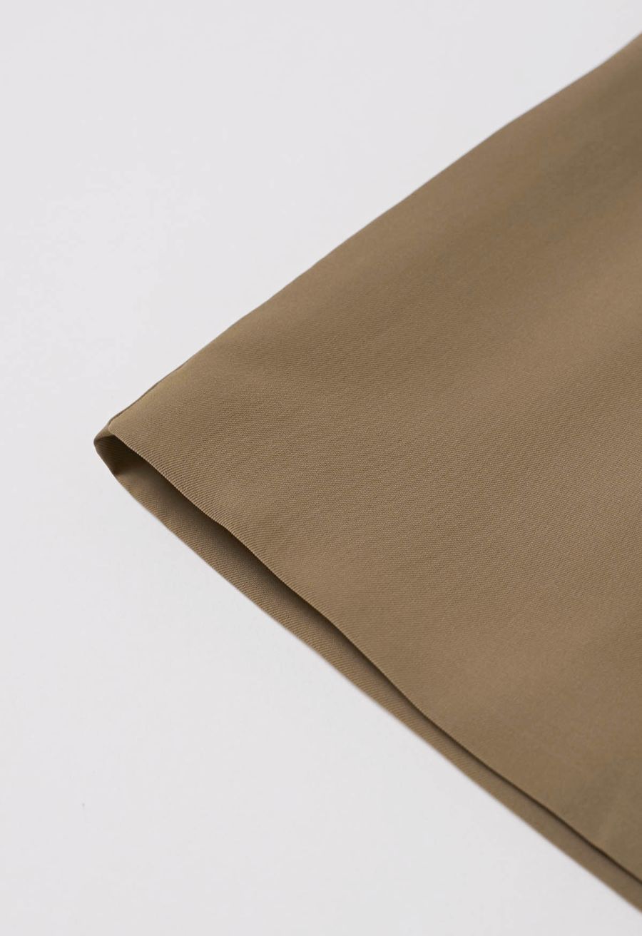 Button-Embellished Dipped Front Waist Shorts in Brown