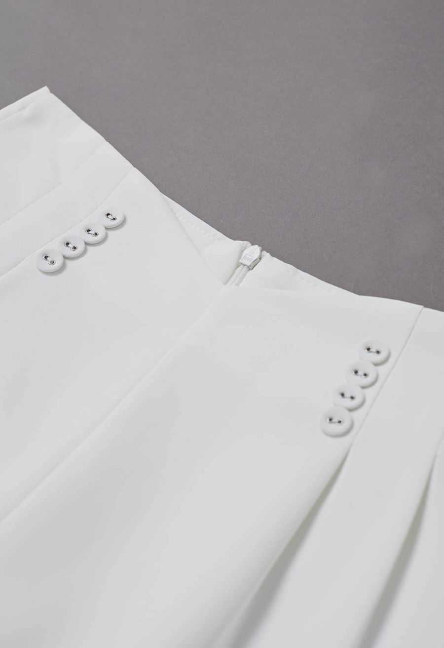 Button-Embellished Dipped Front Waist Shorts in White