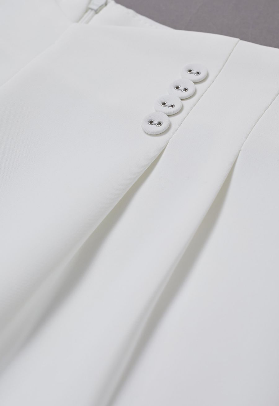 Button-Embellished Dipped Front Waist Shorts in White
