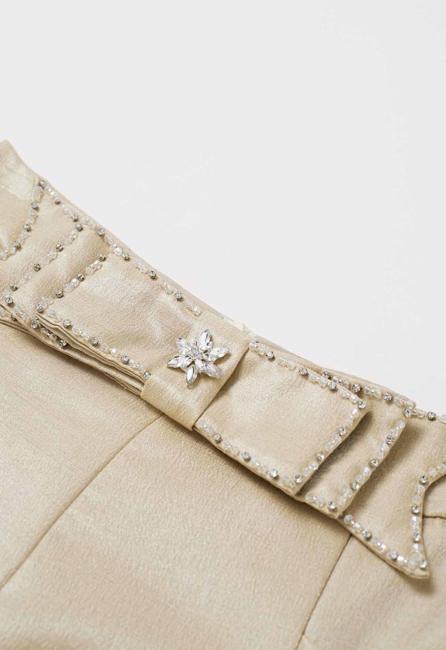 Delicate Rhinestone Bow Front Pocket Shorts in Gold