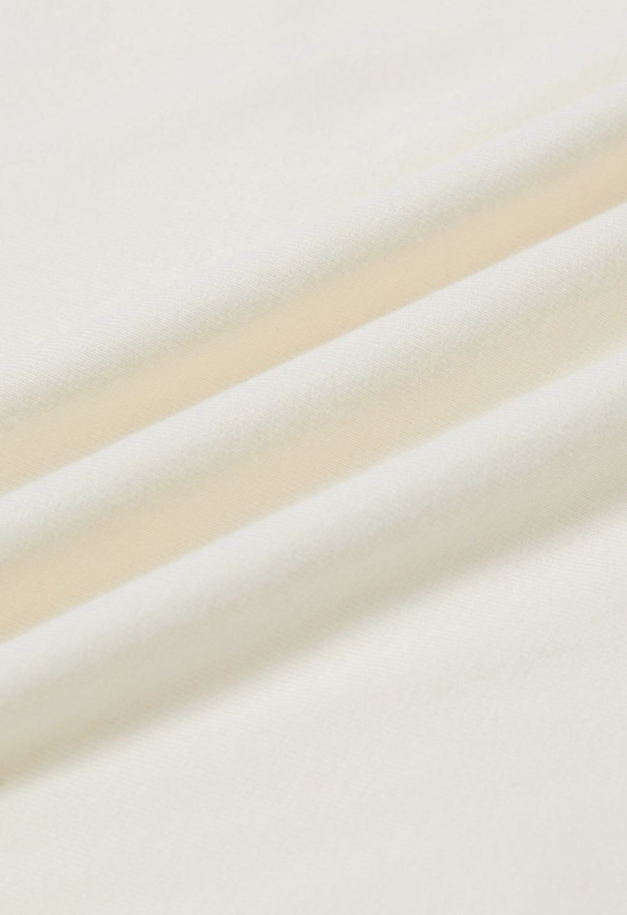 Cowl Neck Buttoned Asymmetric Hem Top in Cream
