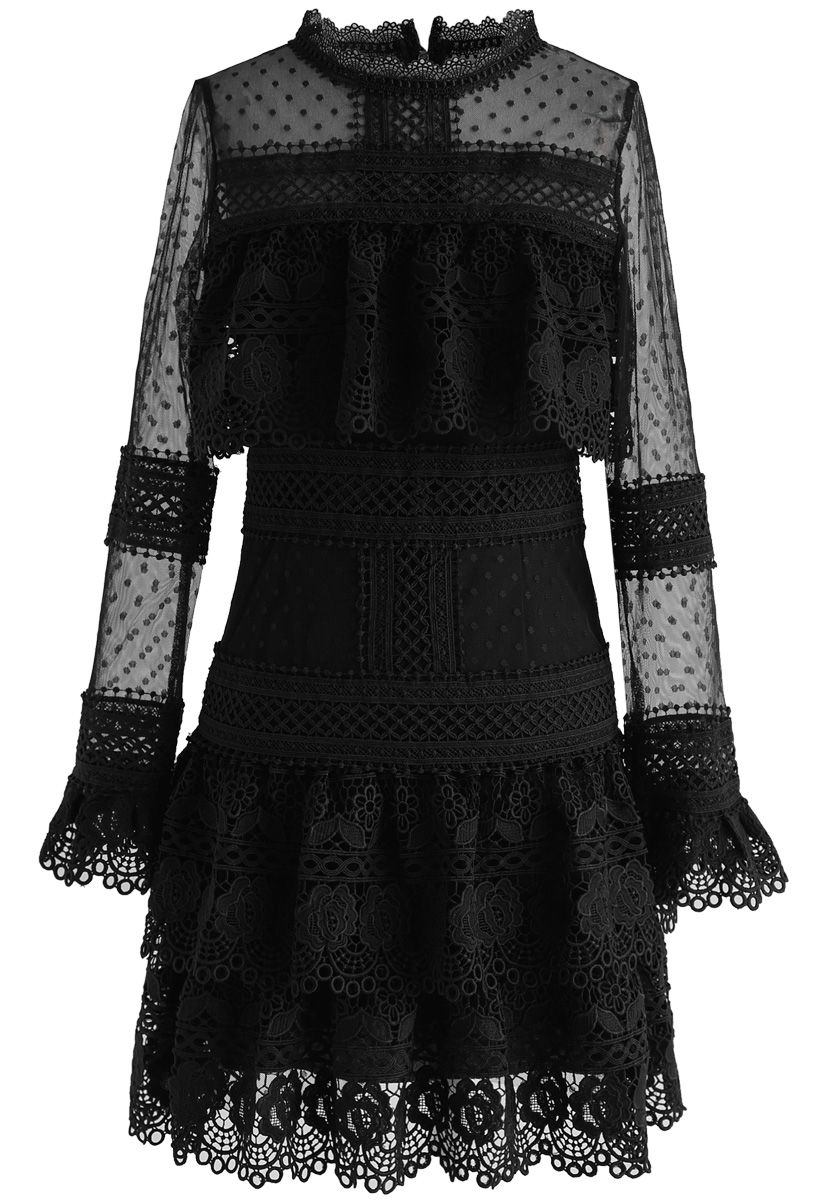 Front view of a black crochet mesh dress with tiered layers and intricate lace details, creating a romantic and elegant look.