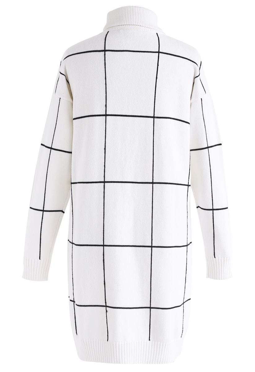Back view of a white turtleneck sweater dress with a black grid pattern, displaying its clean and modern style.