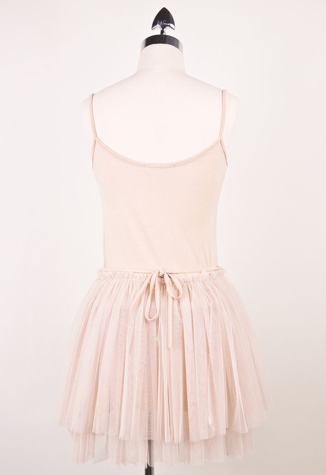Back view of a ballet tulle dress with a charming bow detail and flowing tulle skirt.