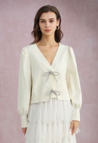 Sparkling Bowknot Buttoned Lantern Sleeve Knit Cardigan in Cream