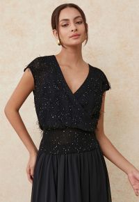 Sequins Tassel Trim Wrap Sleeveless Knit Top in Black